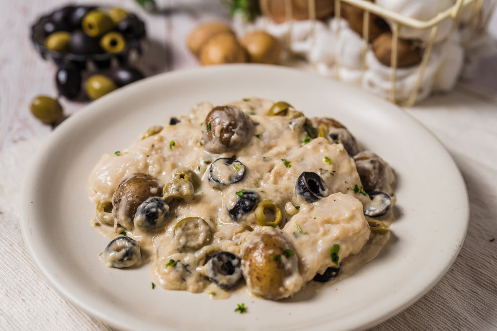 BAKED FISH IN BASIL CREAM WITH BABY POTATOES AND BLACK OLIVES